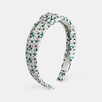 طوق شعر للفتيات وعليه عقدة.